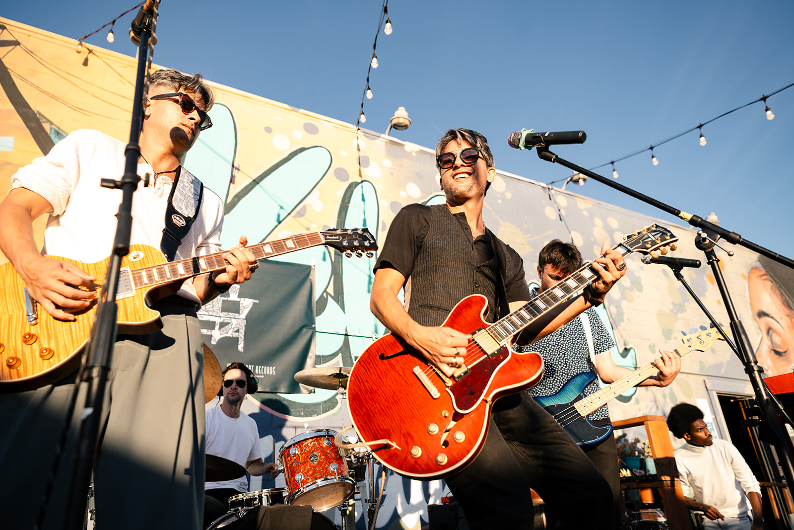 A band playing an energetic set on stage