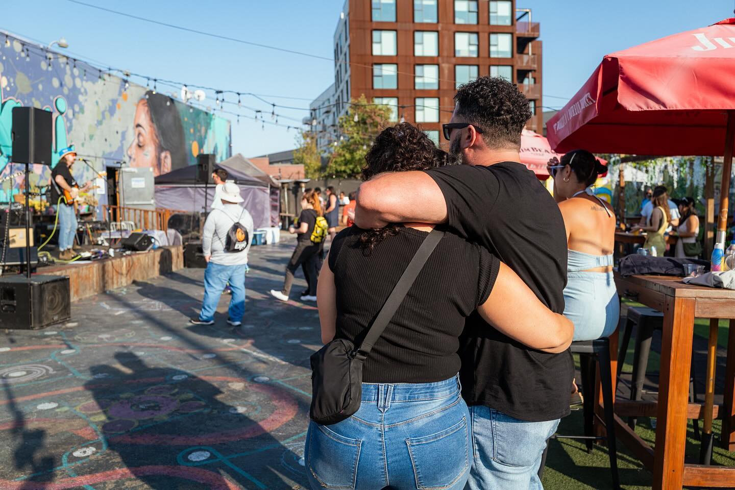 A couple embracing at an outdoor show