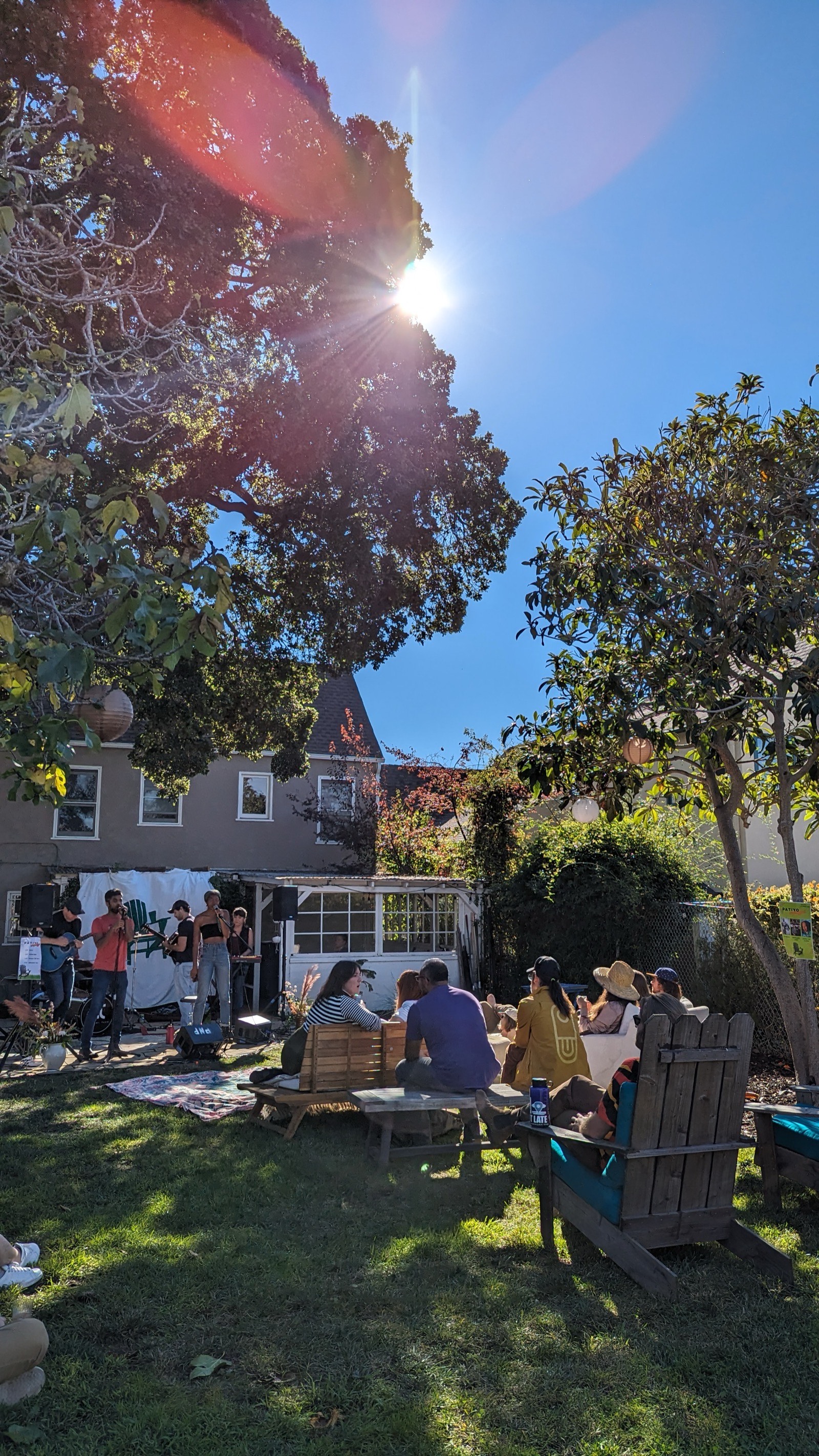 Sunflare over the backyard crowd and stage